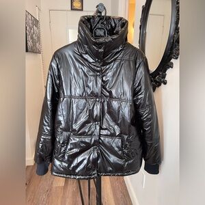 Black puffer , shiny material , black